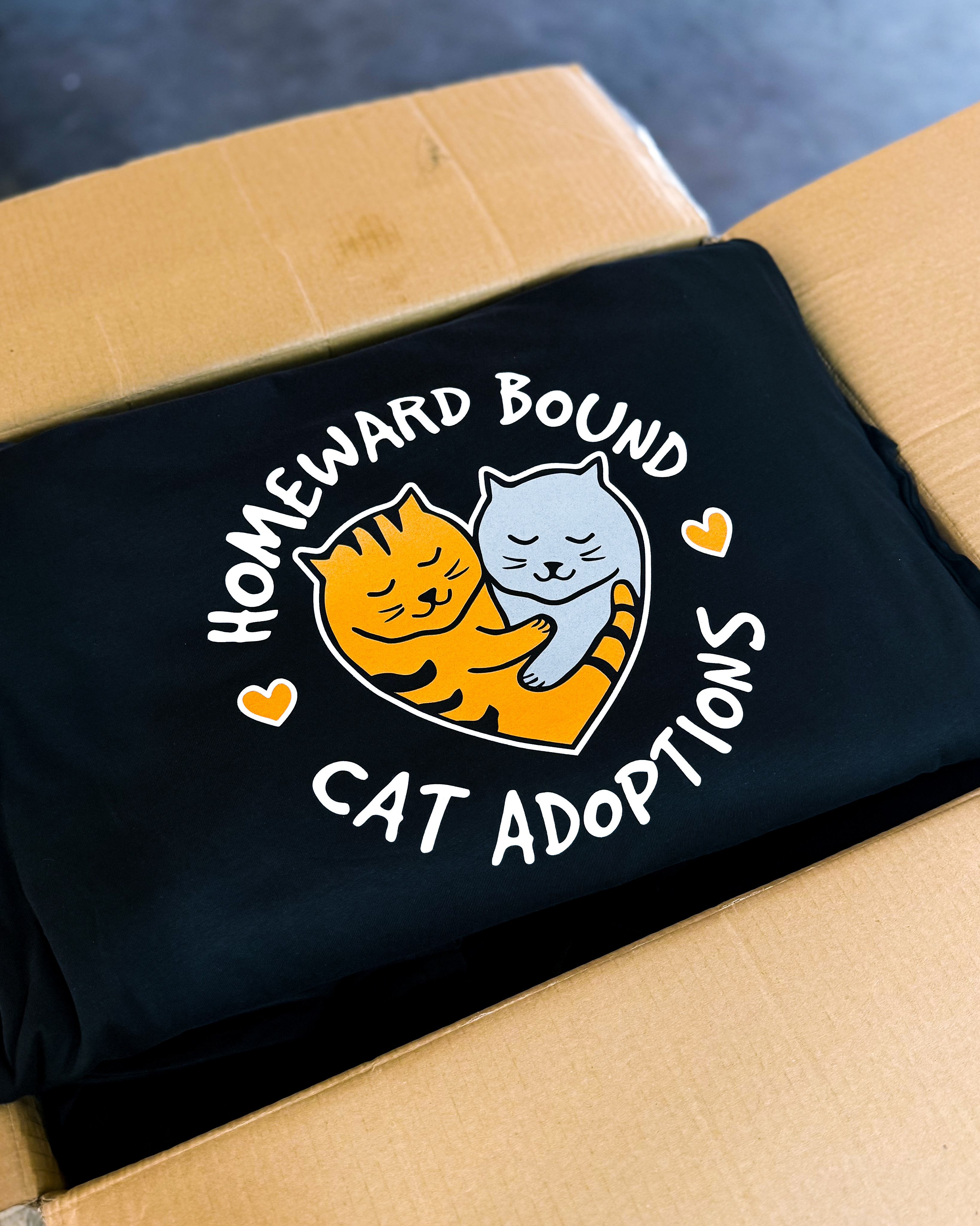 Homeward Bound cat adoptions design printed on a black shirt